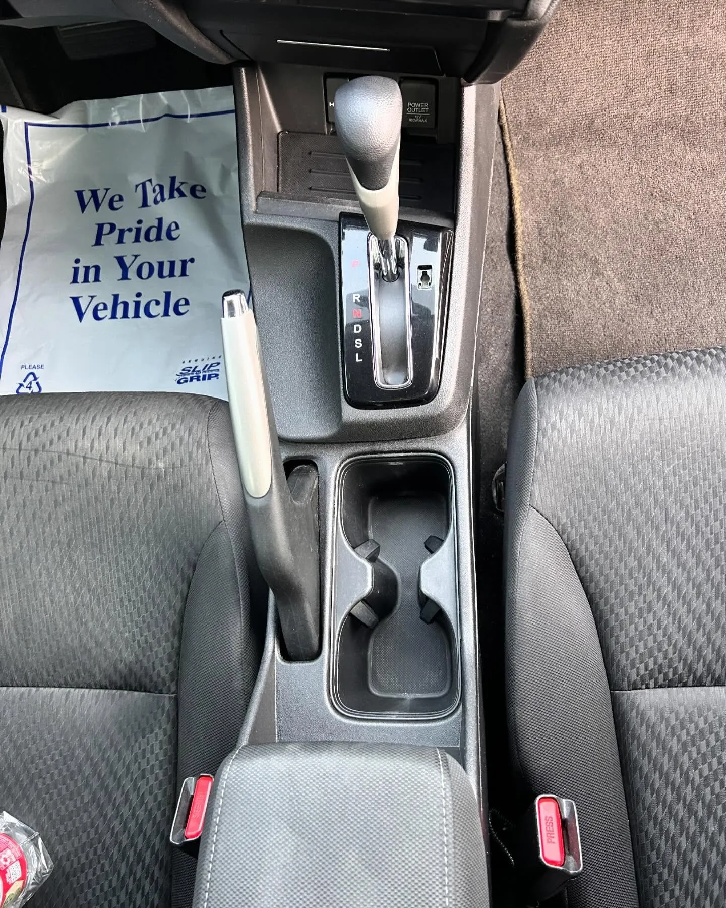 After: the center console and cup holders of the same Honda Civic