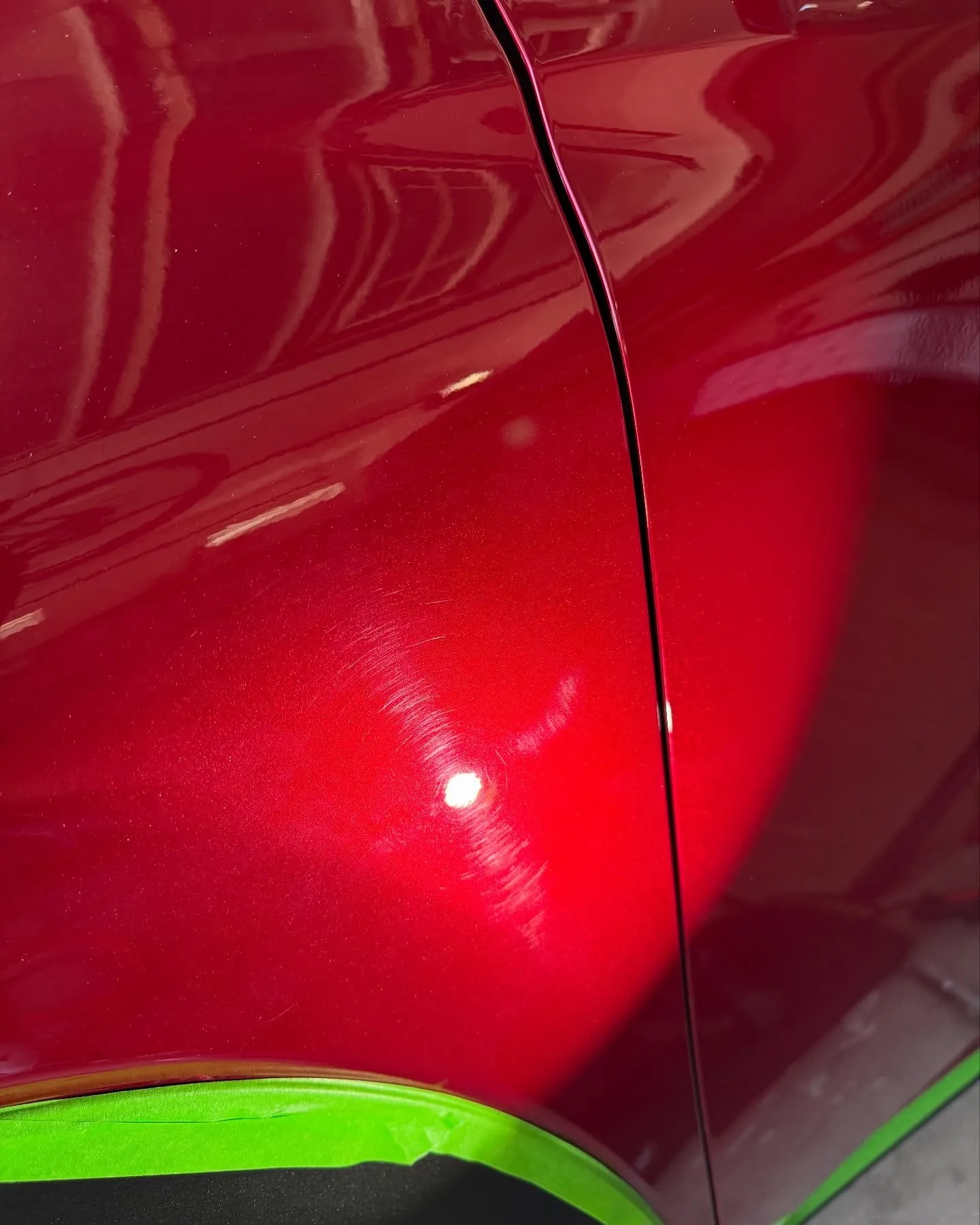 Before: the door of a red Lexus NX under direct sun