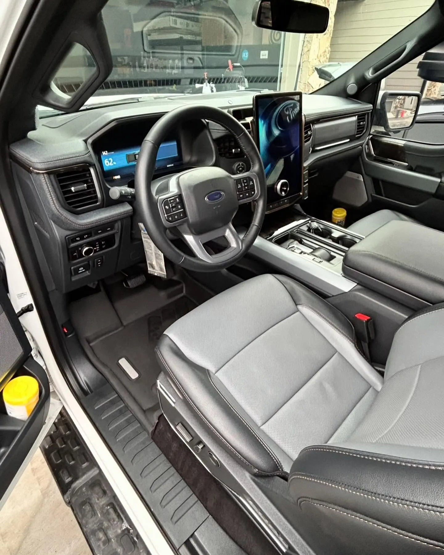 The cabin of a Ford F-150 after an interior detail, seats and dash clean